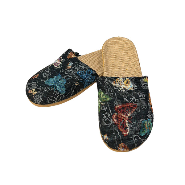 Pair of slippers with butterfly pattern on a white background