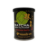 Black canister of Matcha green tea powder with Maeda-en branding on a white background
