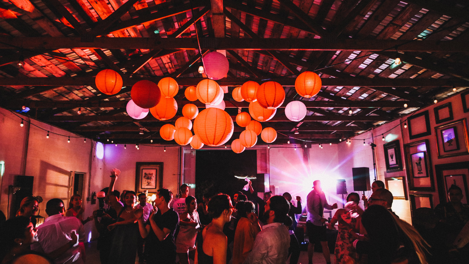 Revelers under lanterns at Chinese wedding